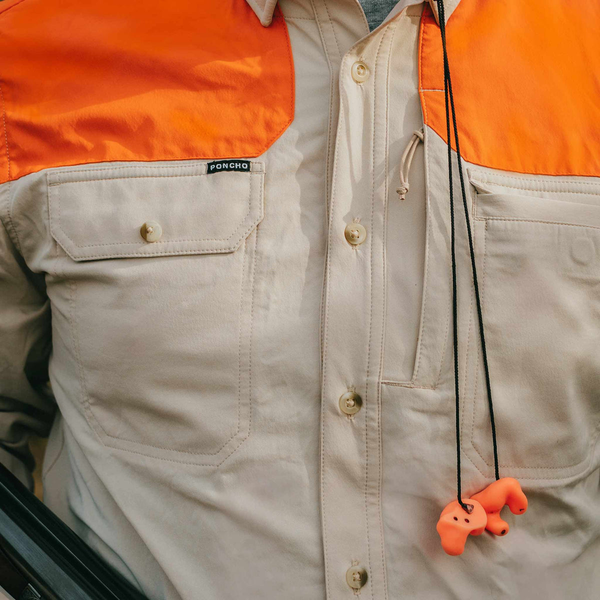 front view of short sleeve tan shirt with blaze patch